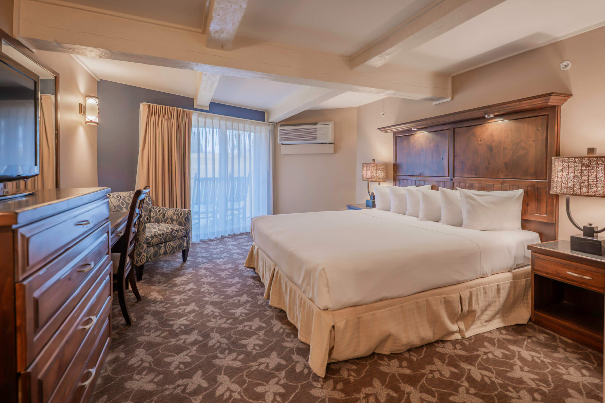 Lakewood Coastal King guest room at Lake Lawn Resort, shown here with two queen beds and a private balcony