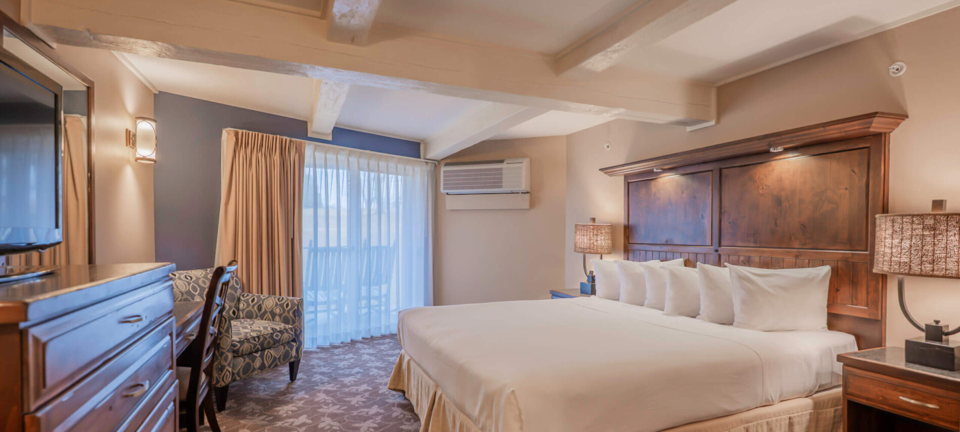 Lakewood Coastal King guest room at Lake Lawn Resort, shown here with two queen beds and a private balcony