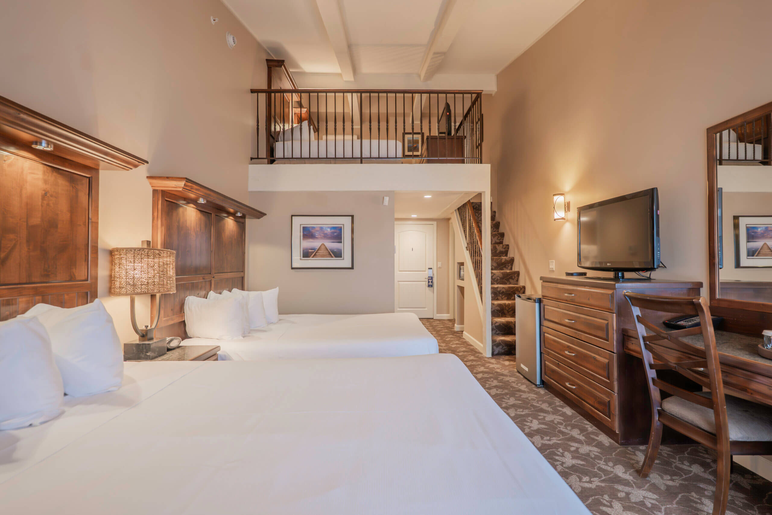 Lakewood Coastal Queen Loft guest room with two double beds and a mezzanine level, Lake Lawn Resort