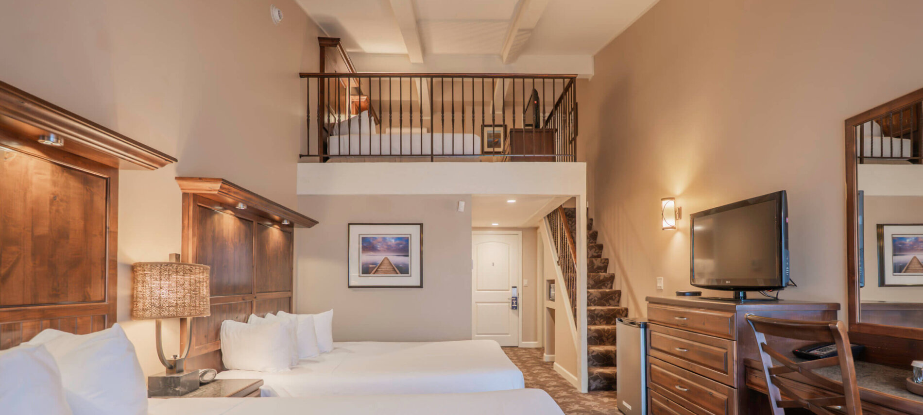 Lakewood Coastal Queen Loft guest room with two double beds and a mezzanine level, Lake Lawn Resort