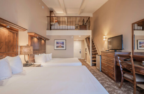 Lakewood Coastal Queen Loft guest room with two double beds and a mezzanine level, Lake Lawn Resort