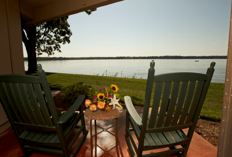 Rocking chairs at Lake Lawn Resort. The chairs overlook Delavan Lake.