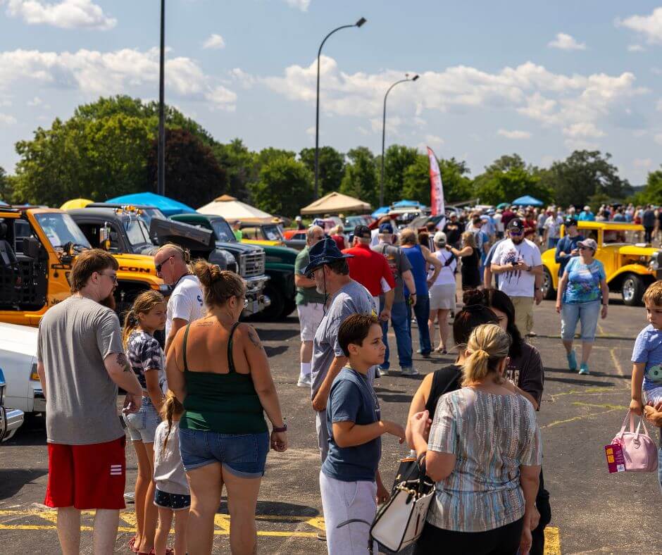 Rev-Up Weekend
The Cars That Time Forgot Car Show
Lake Lawn Airport
There are tons of classic cars, and tons of people looking at the cars and enjoying themselves. It's summer time, and a lot of people are wearing shorts and tank tops and tshirts.