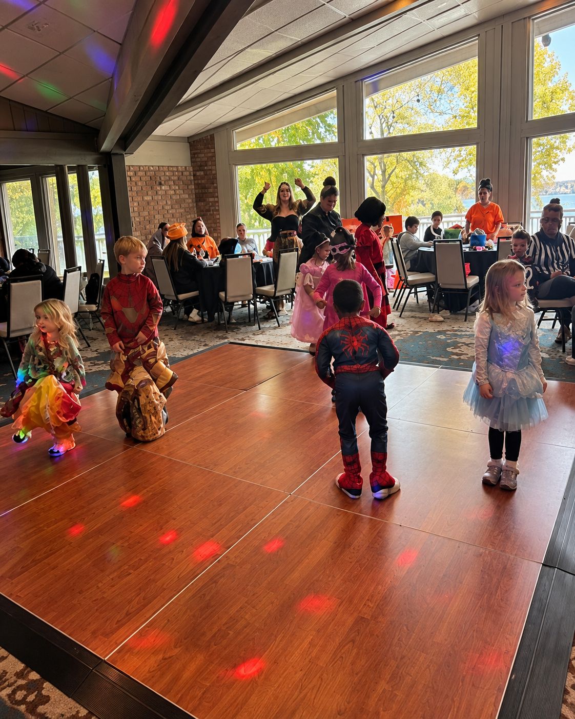 Children in costumes dancing at a family Halloween party at Lake Lawn Resort
